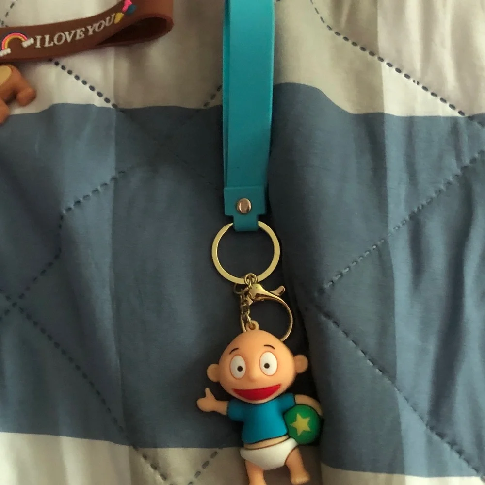 Cute Baby Character Keychain on Teal Wrist Strap
